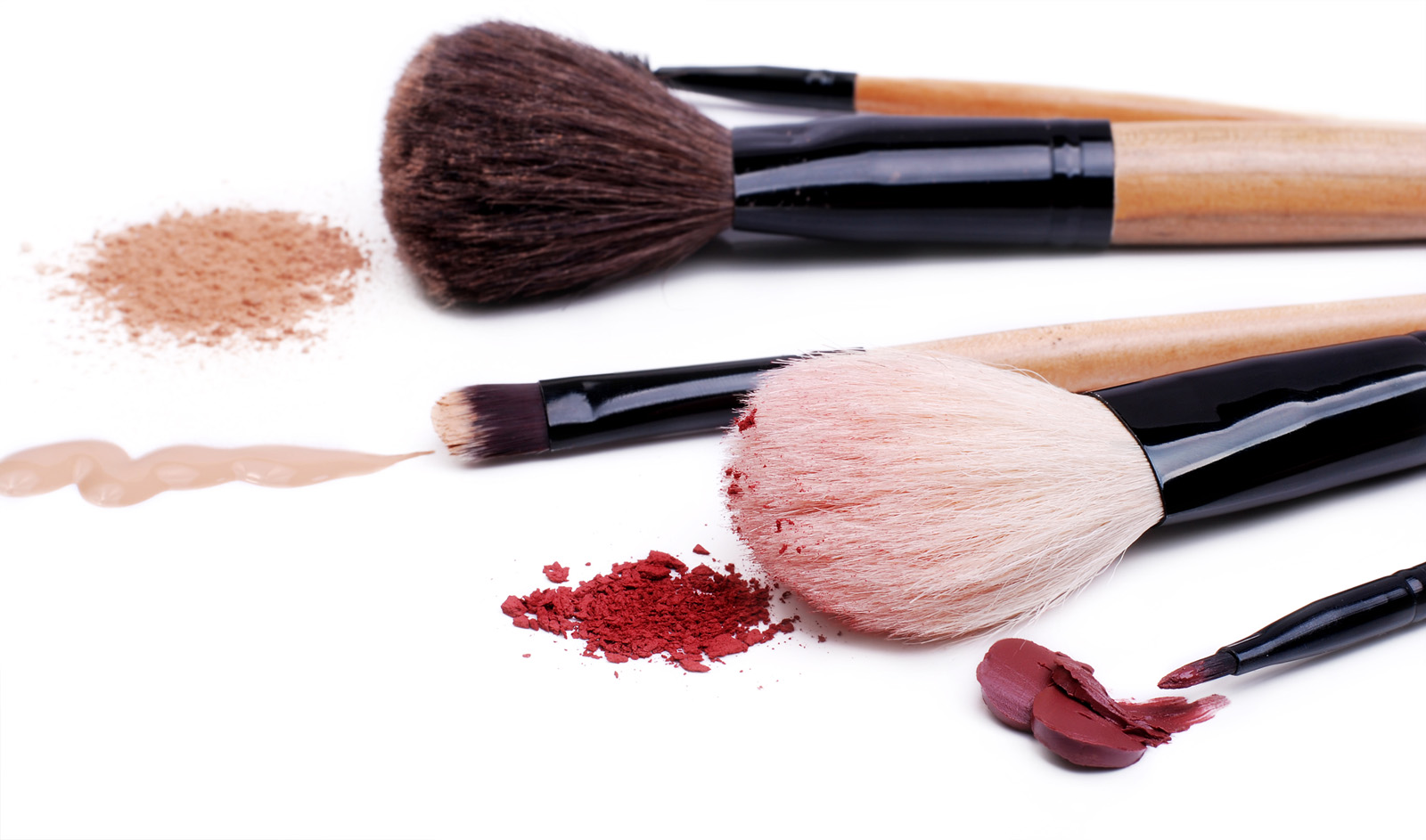 Set of makeup professional brushes with sample cosmetics